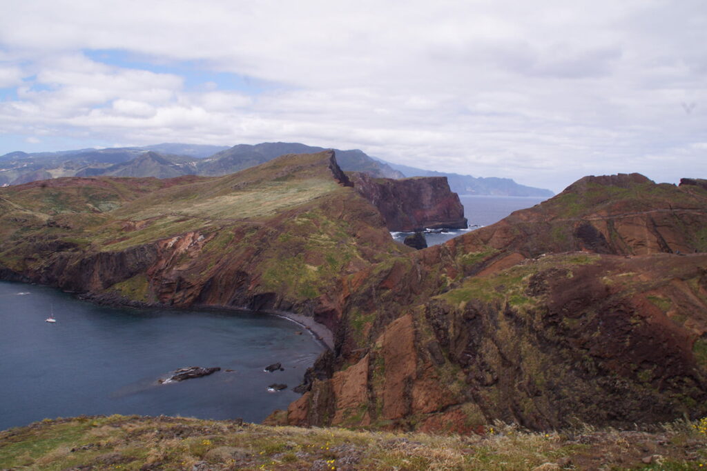 View over cliffs right beside the ocean.