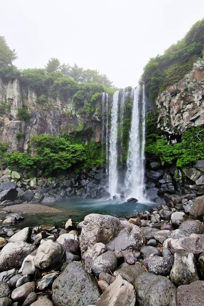 waterfall between cliffs on Jeju island