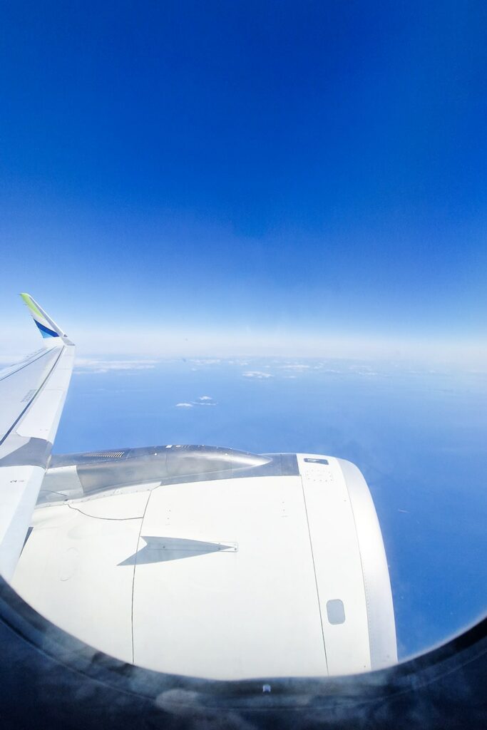 View from airplane window on plane wing on a flight from Jeju to Busan