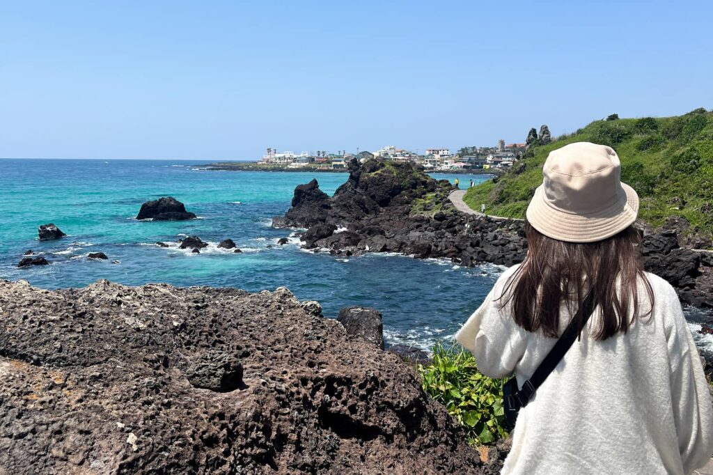 girl standing on handam coastal walk and looking at the sea