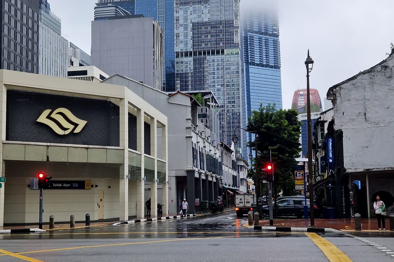 A Metro Train Station in SIngapore with Skyscrapers in the background.