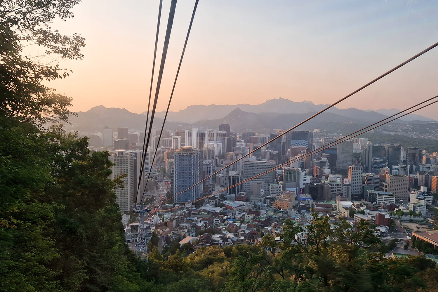 Sunset over Seoul view from the cable car up to Seoul Tower.