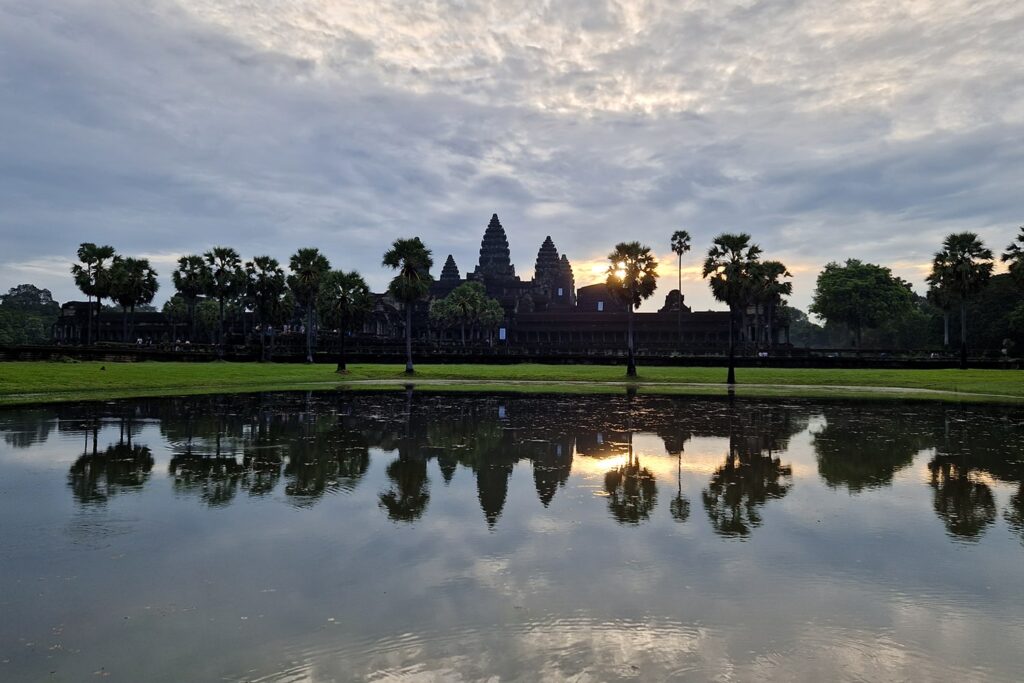 Angkor Wat just after the sun came out and starts going over the the temple.