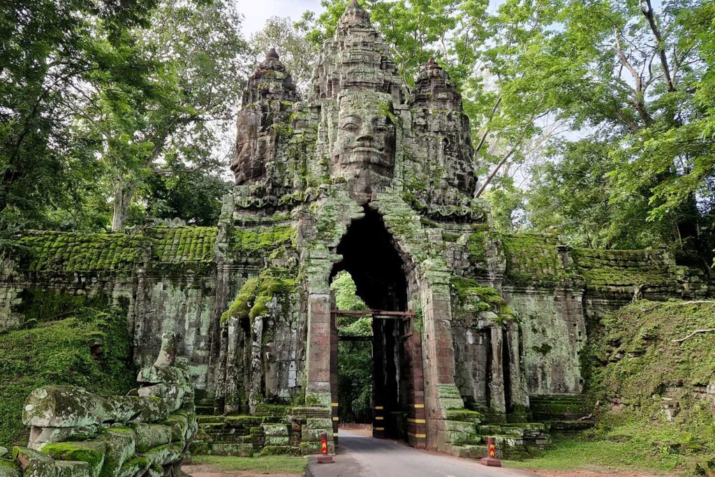 On of 4 gates leading to the different temples in Angkor Wat with 4 heads looking in every major compass point direction.