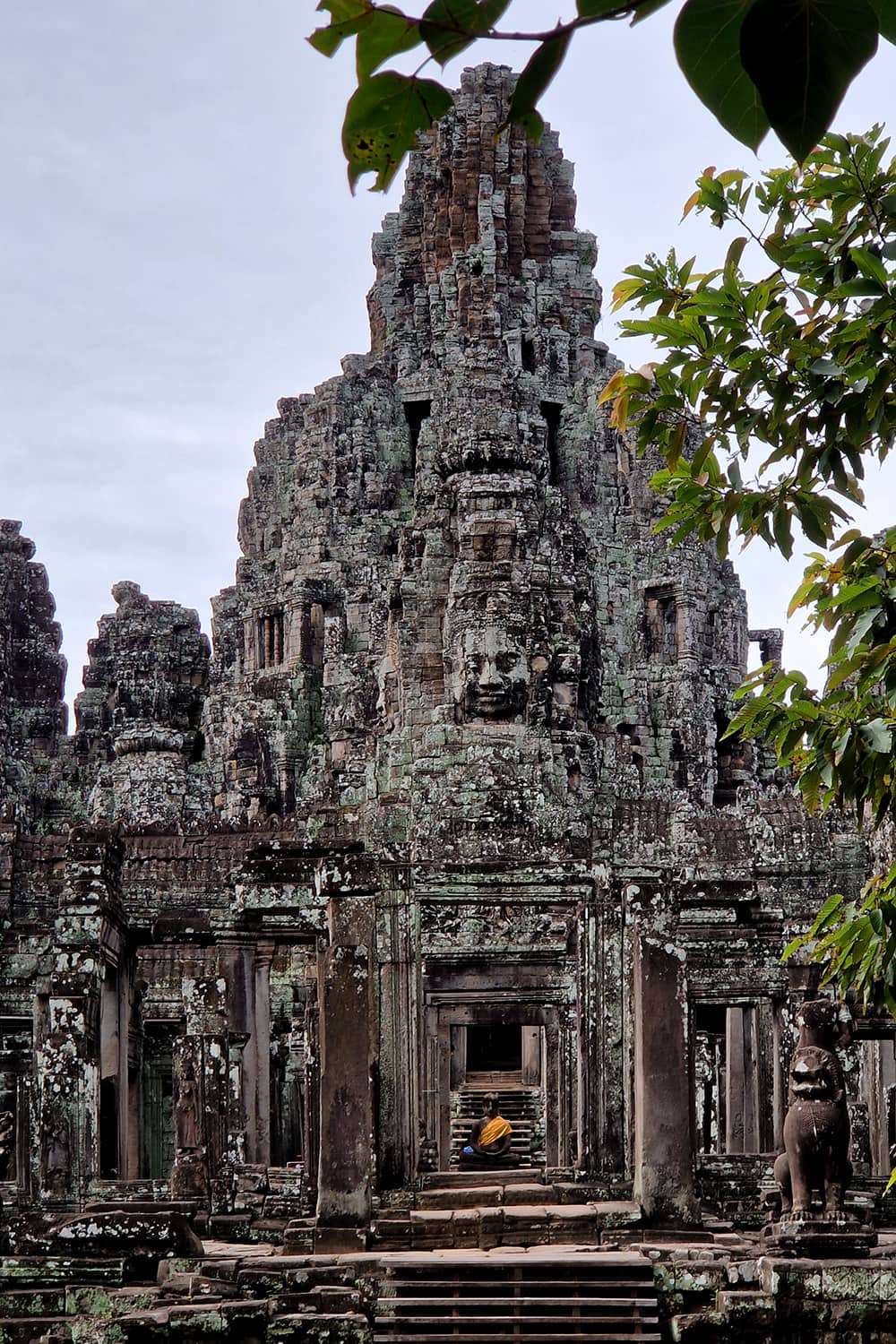 View of the Bayon Temple with a lot of carvings in the temple walls that look like faces.