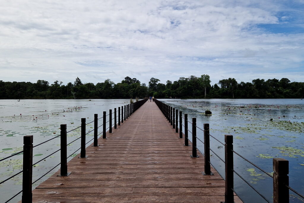 A bridge leading over a huge river directly to the Neak Pean Temple which is part of the Angkor Wat Temple complex.