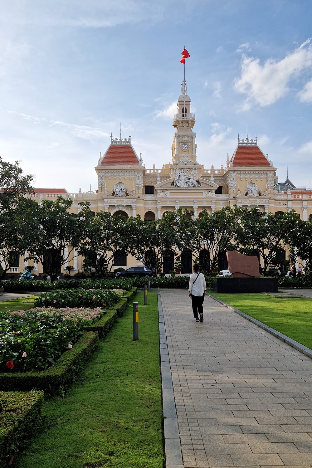 Woman walking up to the office administration building in ho-chi-minh