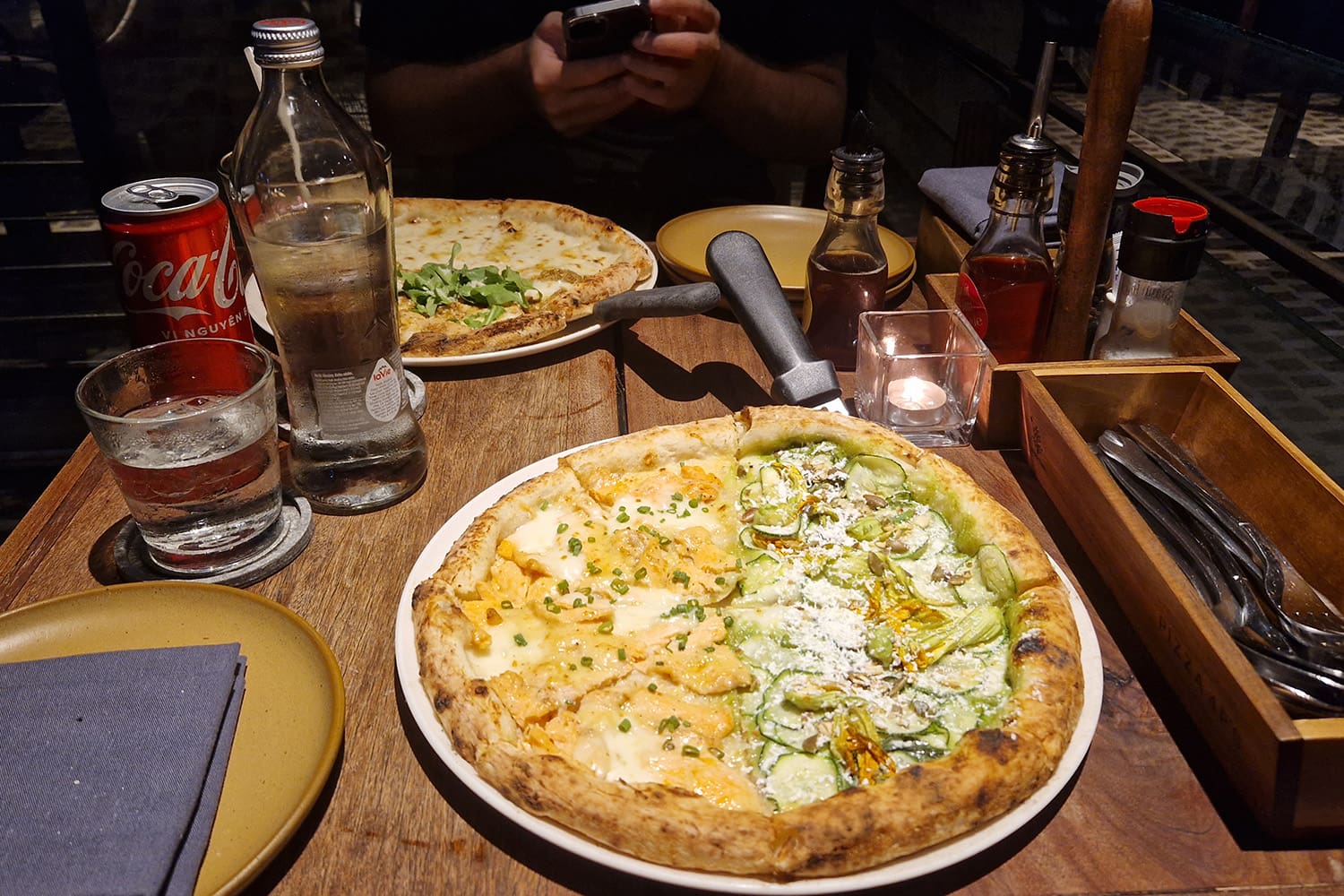 A pizza with salmon and zucchini from $Ps Pizza in Ho-Chi-Minh City.