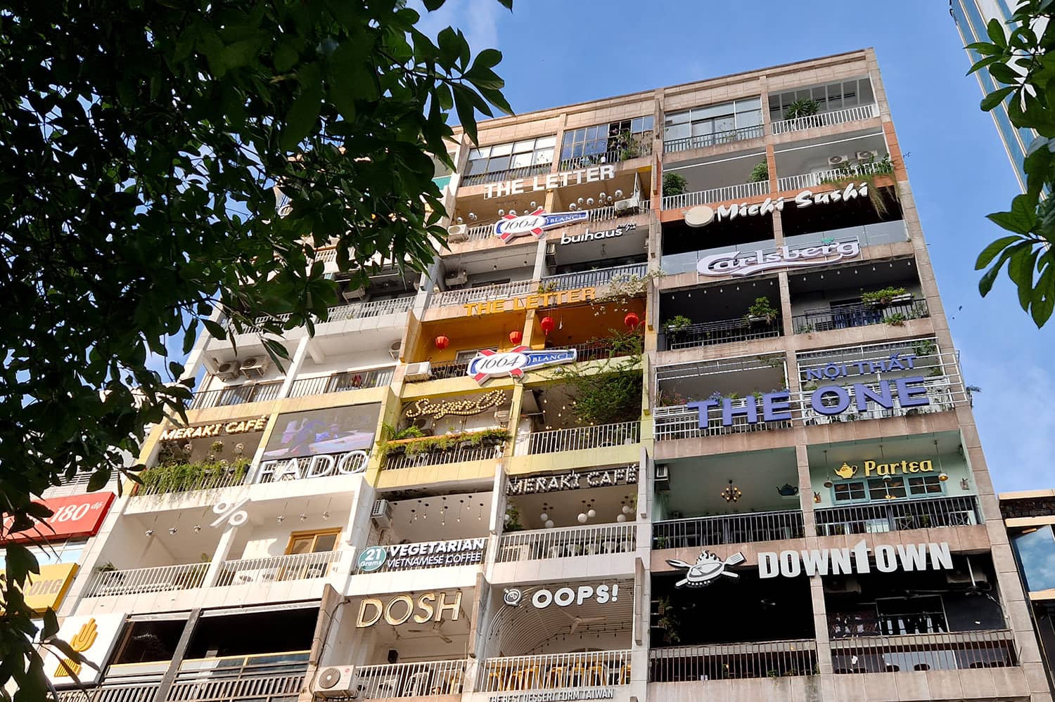 An appartment building with small cafes on every floor in every appartment.