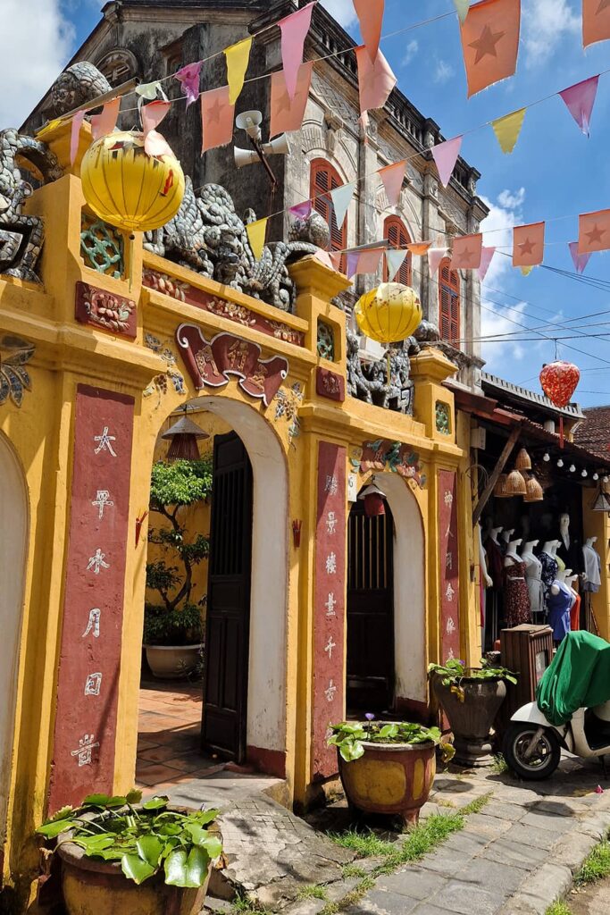 A stunning yellow and red arch entrance to one of the buildings in Hoi An.
